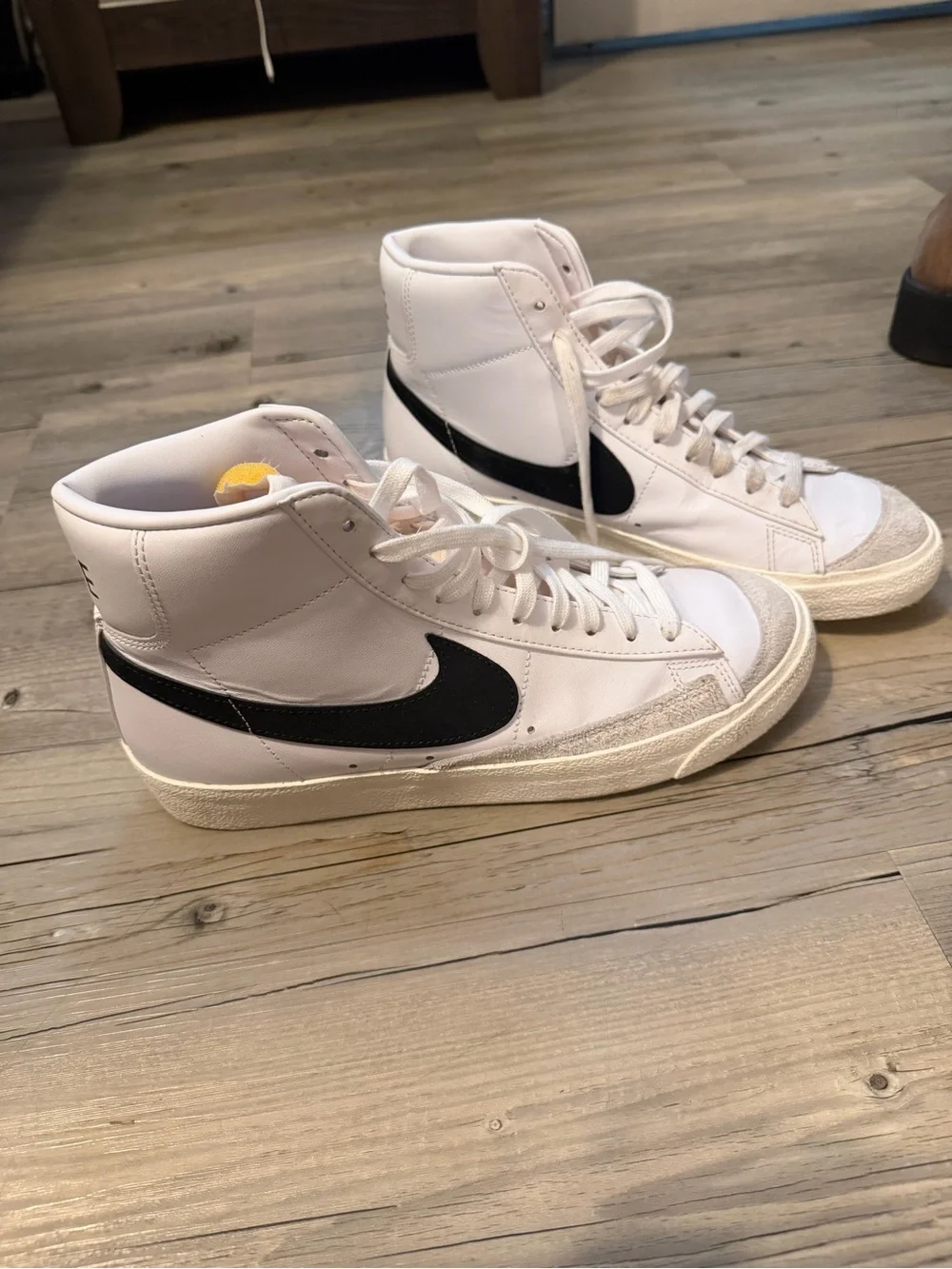 Nike Men’s White High-Top Sneakers with Black Swoosh